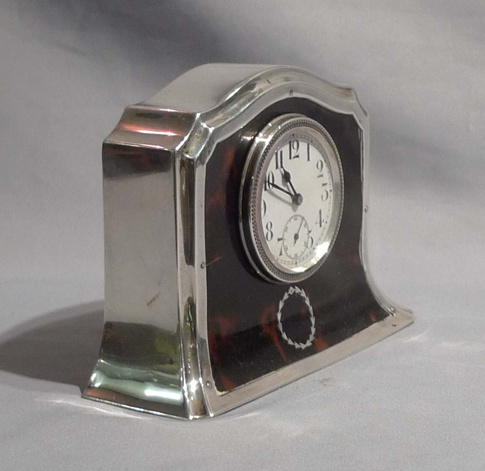 Silver and tortoiseshell pique mantel clock.