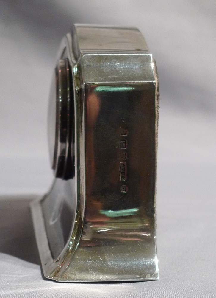 Silver and tortoiseshell pique mantel clock.