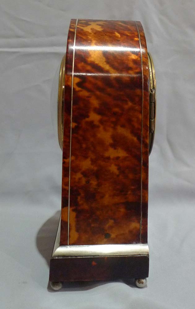 Fine antique tortoiseshell and silver inlaid lancet shaped mantel clock.