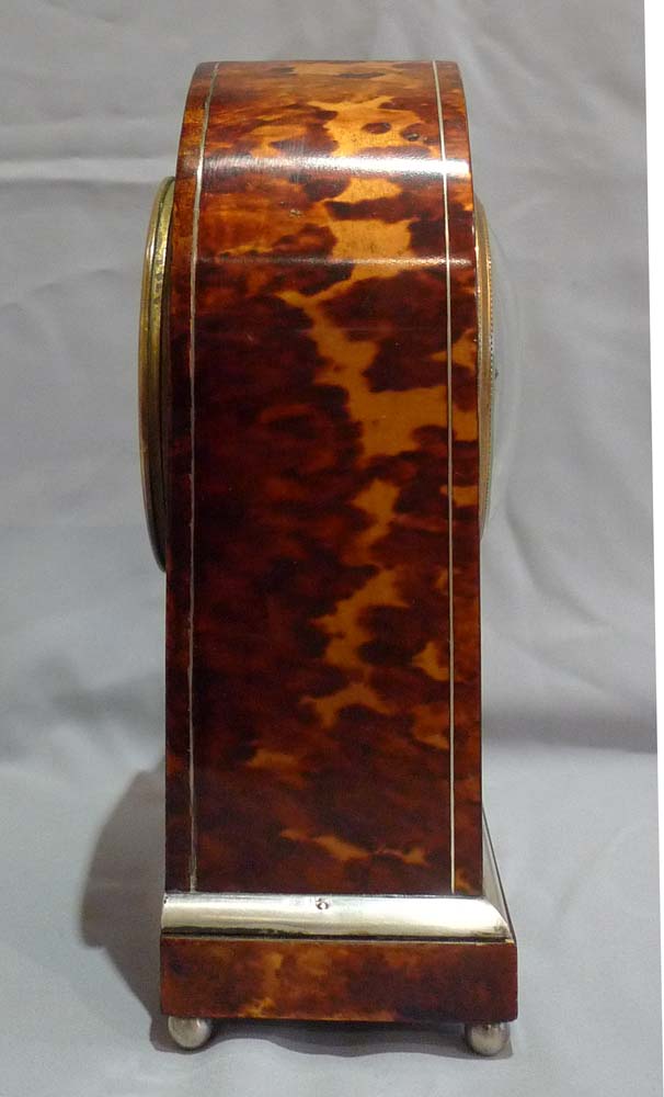 Fine antique tortoiseshell and silver inlaid lancet shaped mantel clock.