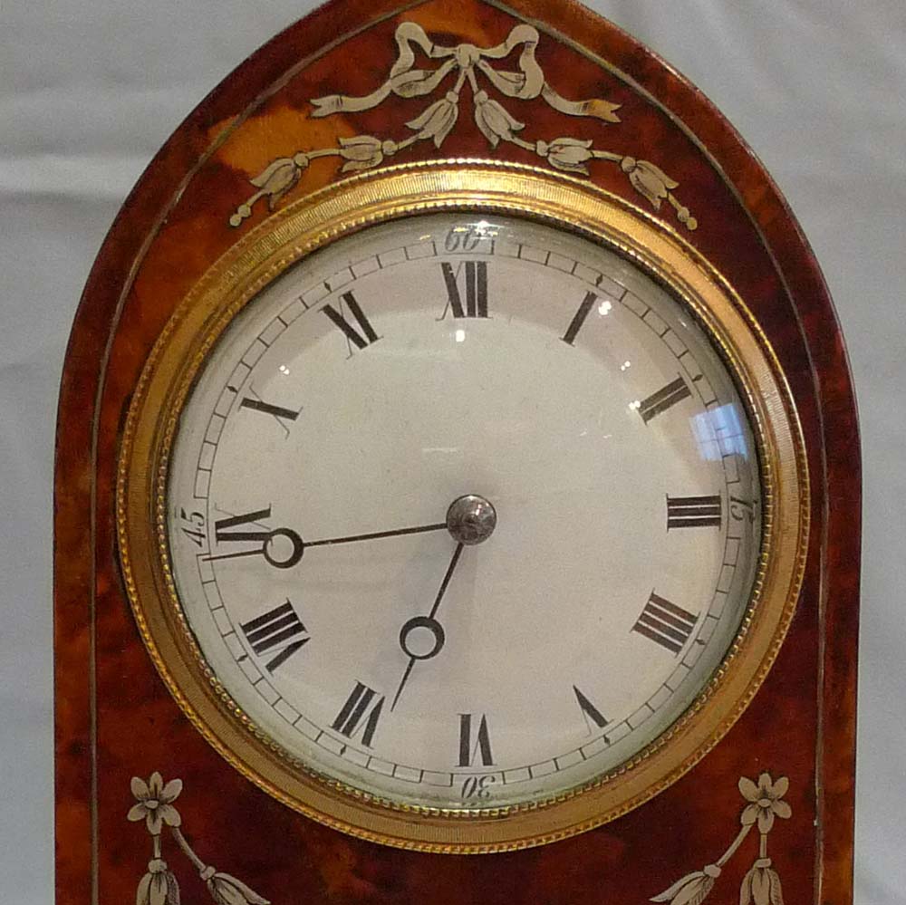 Fine antique tortoiseshell and silver inlaid lancet shaped mantel clock.