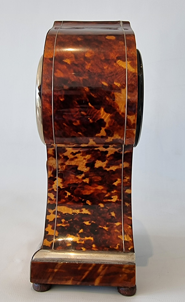 Antique tortoiseshell mantel clock with silver inlay and stringing