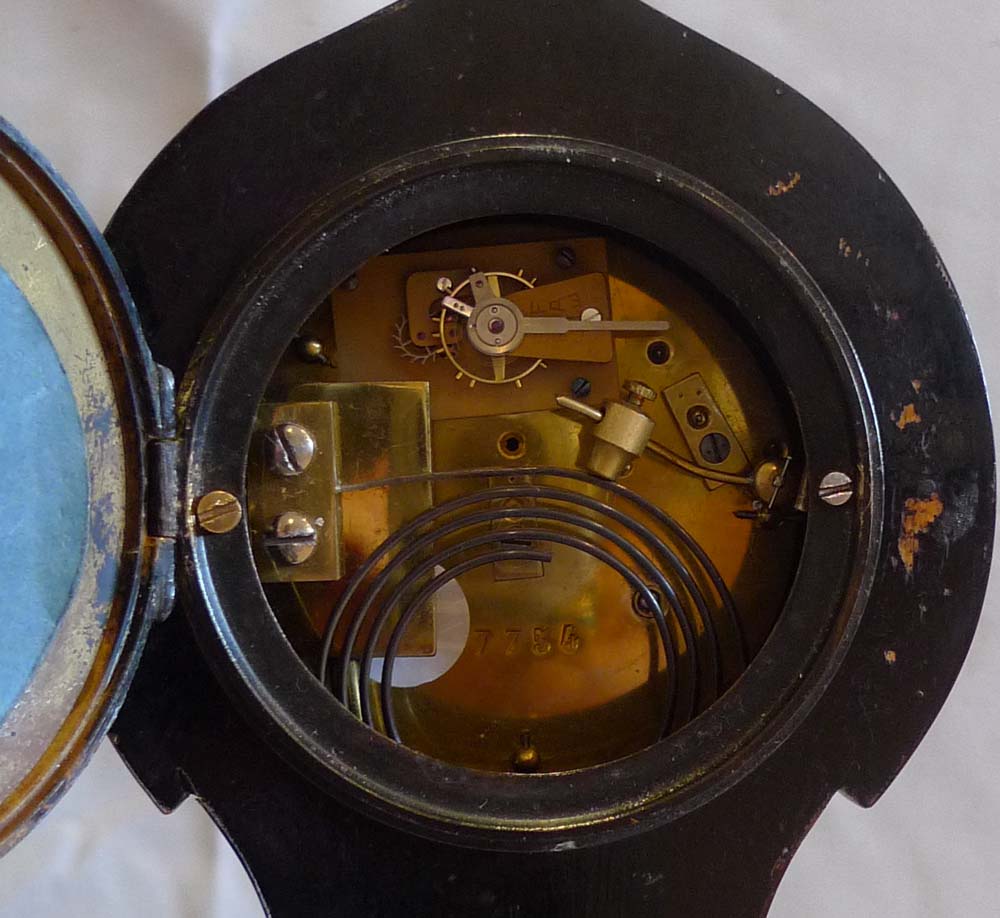 Antique tortoiseshell mantel clock with silver inlay and stringing