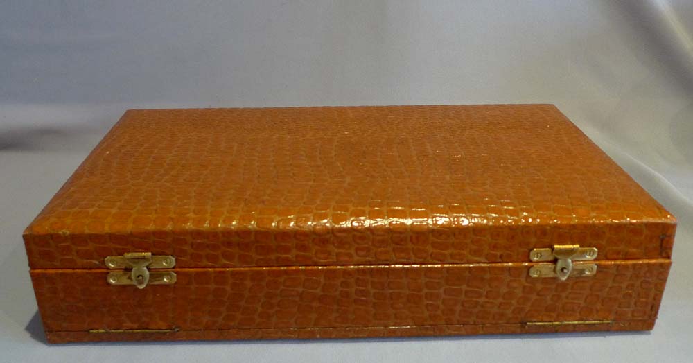Silver and silver pique tortoiseshell hairbrushes and hand mirror in original case.