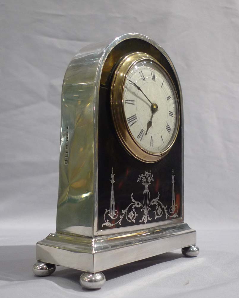 English tortoiseshell, silver pique and leather mantel clock