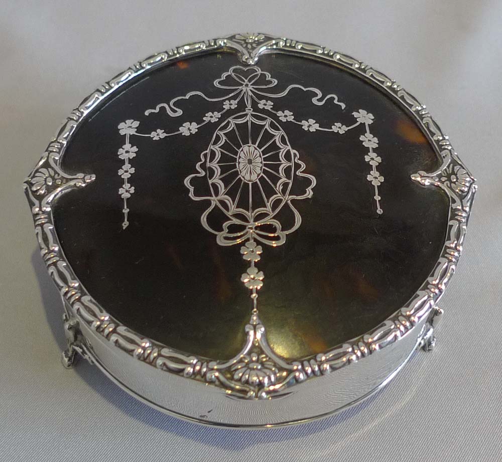 Pair tortoiseshell, silver and silver pique boxes by Mappin and Webb.