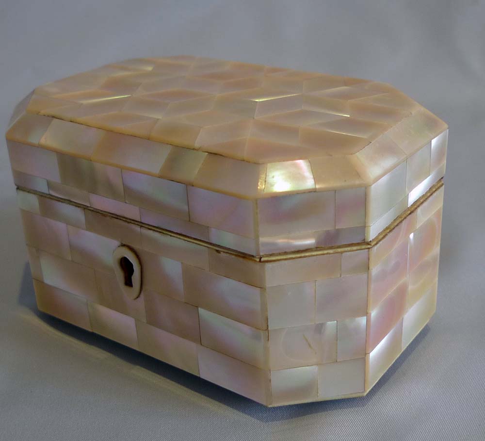 Antique mother of pearl and ivorine casket.