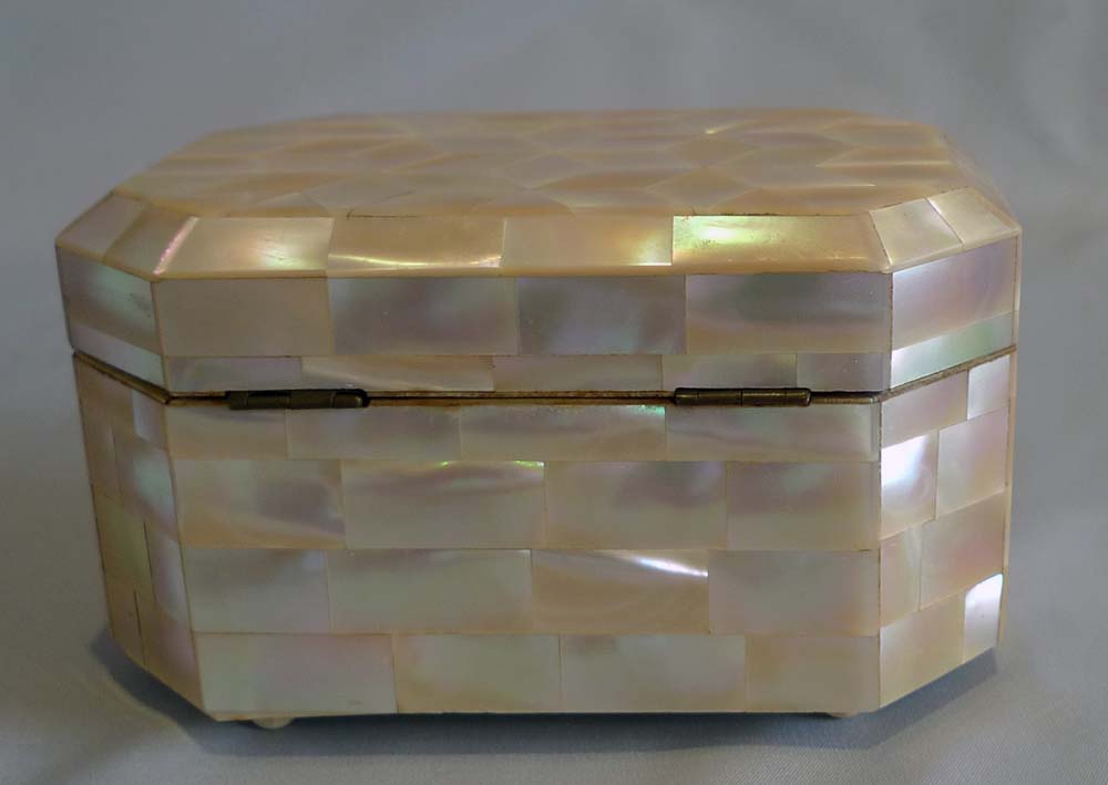 Antique mother of pearl and ivorine casket.