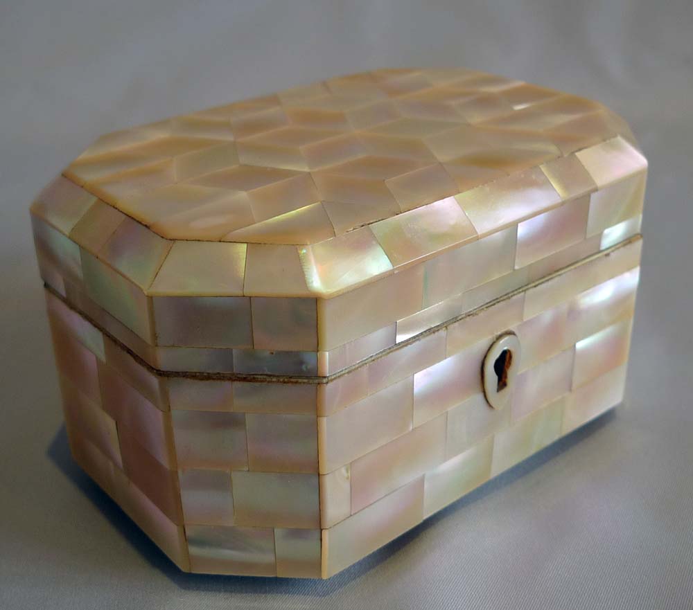 Antique mother of pearl and ivorine casket.