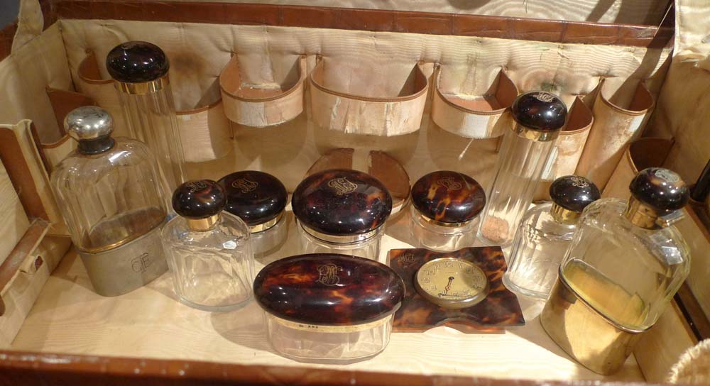 Crocodile cased dressing set in silver, crystal and tortoiseshell hallmarked for 1920.