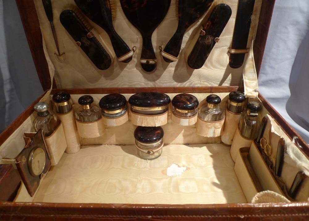 Crocodile cased dressing set in silver, crystal and tortoiseshell hallmarked for 1920.