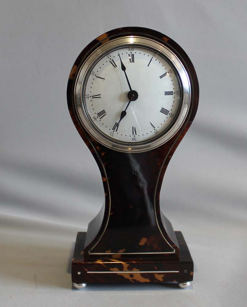 Antique English tortoiseshell and silver strung balloon shaped mantel clock.