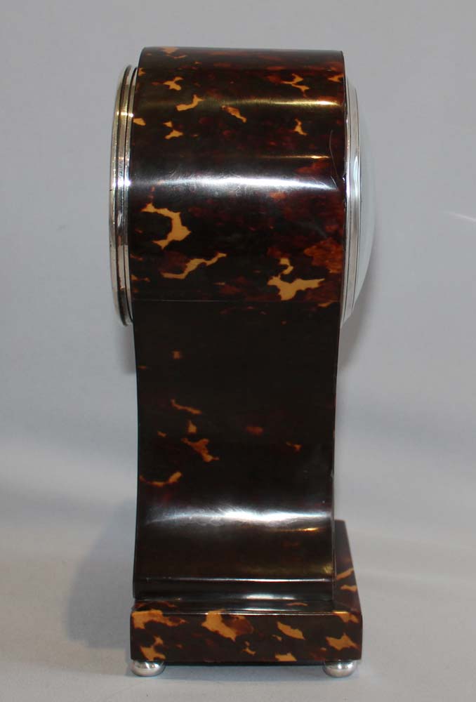 Antique English tortoiseshell and silver strung balloon shaped mantel clock.