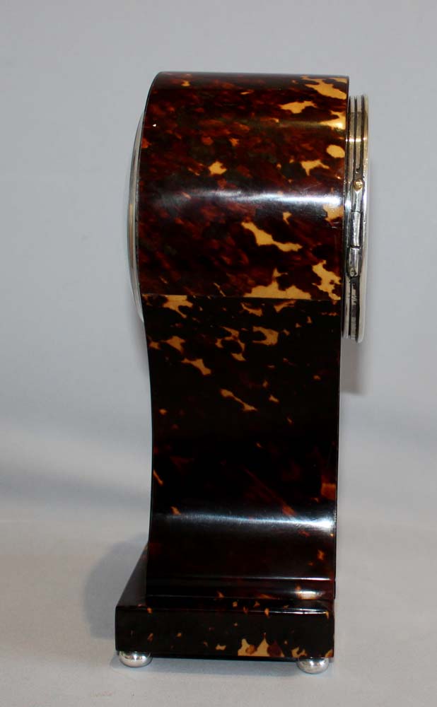 Antique English tortoiseshell and silver strung balloon shaped mantel clock.