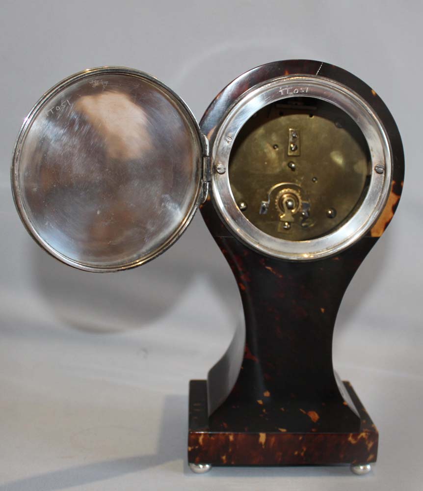 Antique English tortoiseshell and silver strung balloon shaped mantel clock.