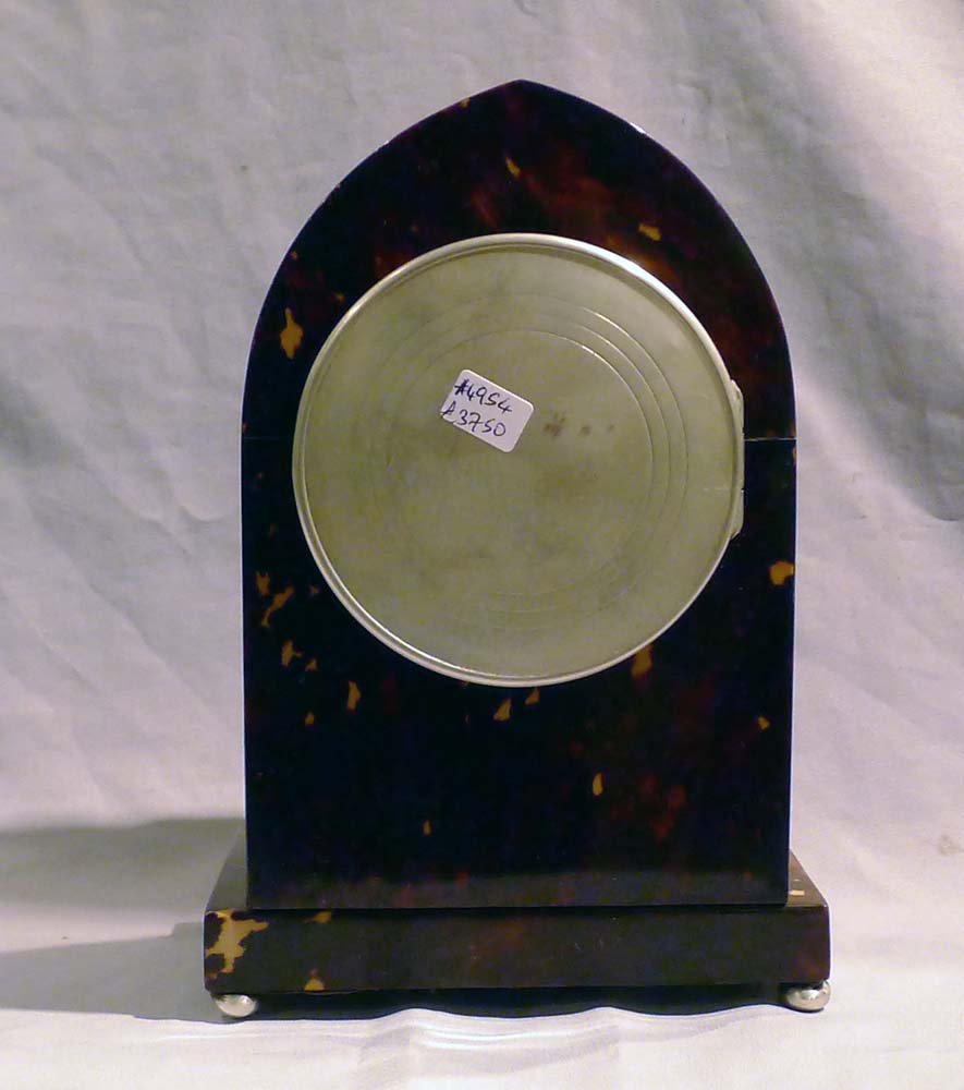 Fine Tortoiseshell mantel clock lancet topped with silver stringing and enamel dial.