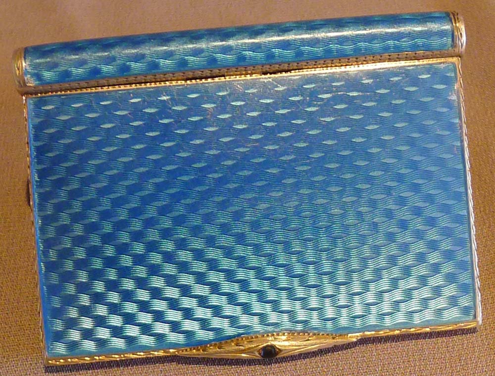 Guilloche enamel and silver card case with saphire button.