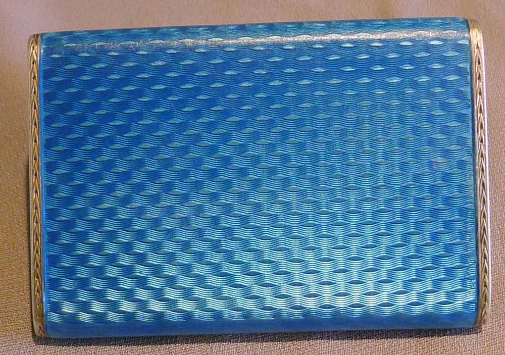 Guilloche enamel and silver card case with saphire button.