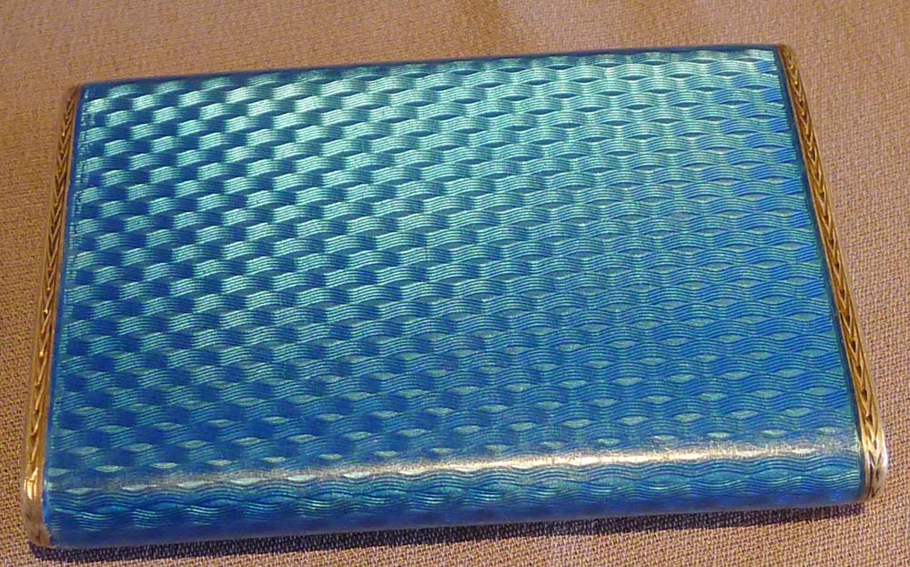 Guilloche enamel and silver card case with saphire button.