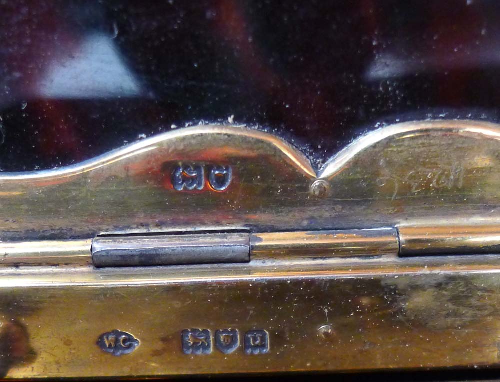 A fine silver mounted tortoiseshell carriage clock.