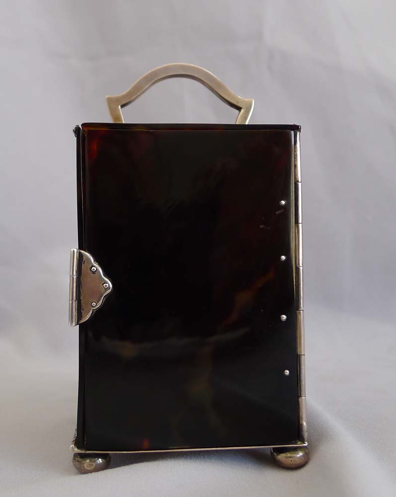 Antique English tortoiseshell and silver piquet carriage clock by William Comyns. London 1905.