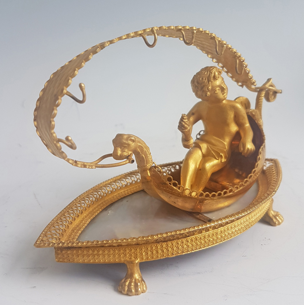 Palais Royal mother-of-pearl and ormolu Ring stand modelled as cupid in a Gonola