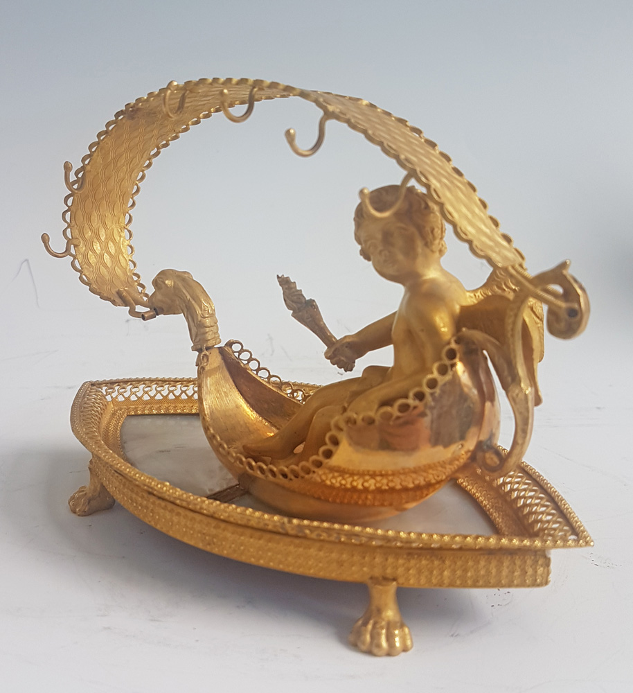 Palais Royal mother-of-pearl and ormolu Ring stand modelled as cupid in a Gonola