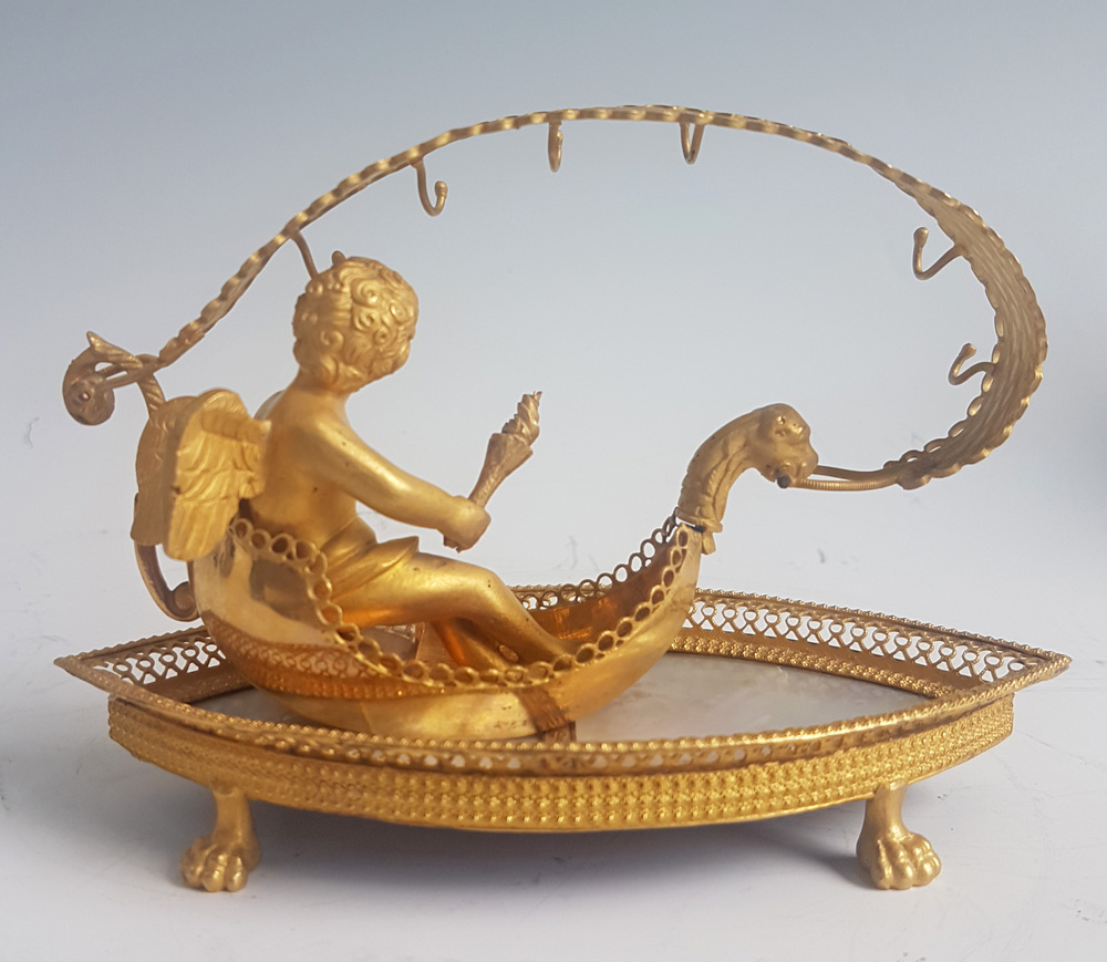 Palais Royal mother-of-pearl and ormolu Ring stand modelled as cupid in a Gonola