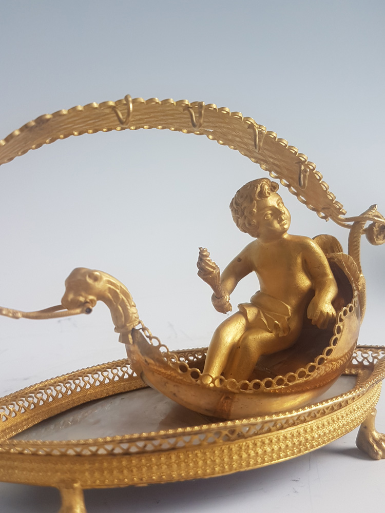Palais Royal mother-of-pearl and ormolu Ring stand modelled as cupid in a Gonola