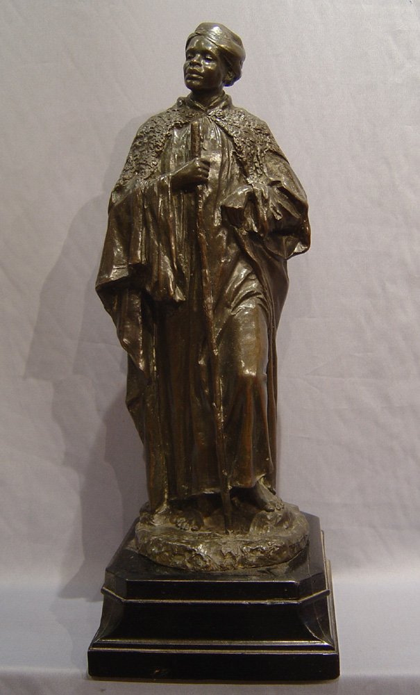 English Bronze figure of a Negro man on shaped base.