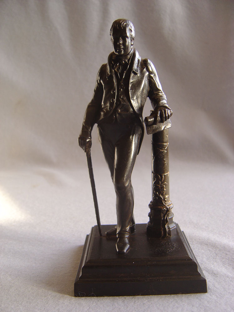 Antique English cast iron model of Sir Walter Scott.