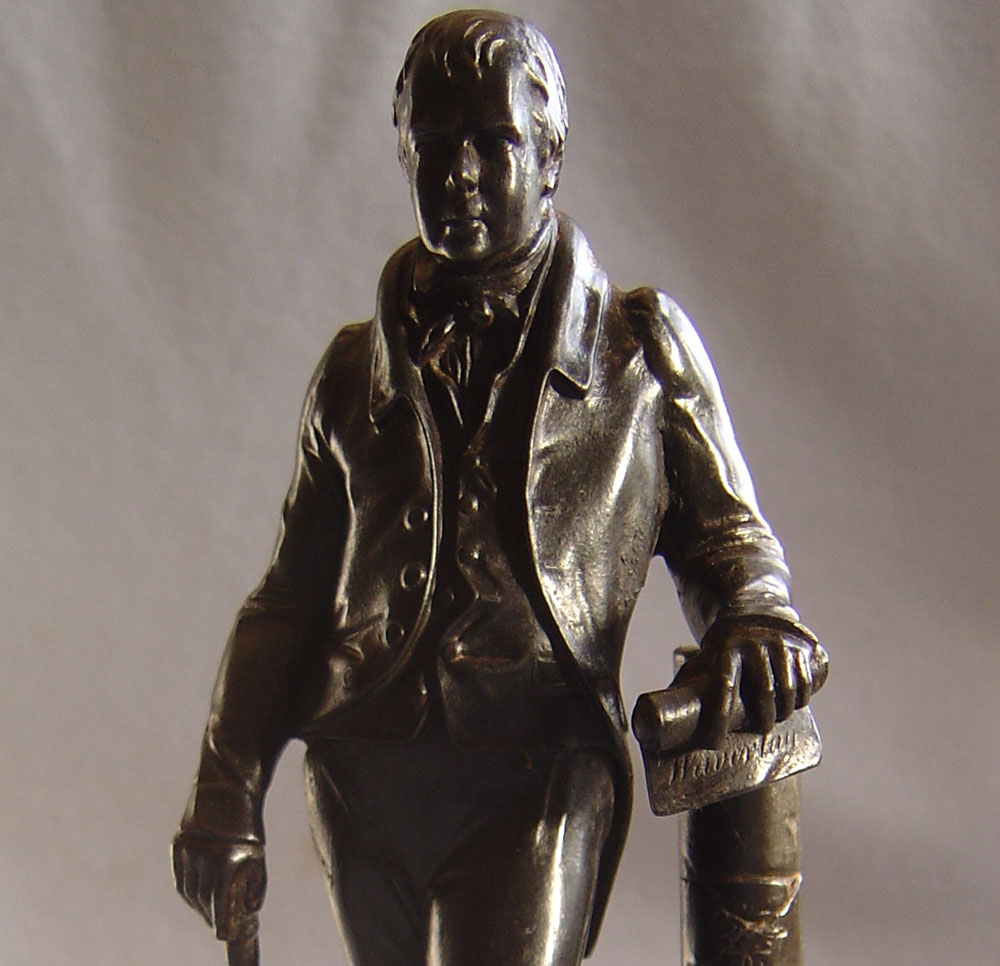 Antique English cast iron model of Sir Walter Scott.