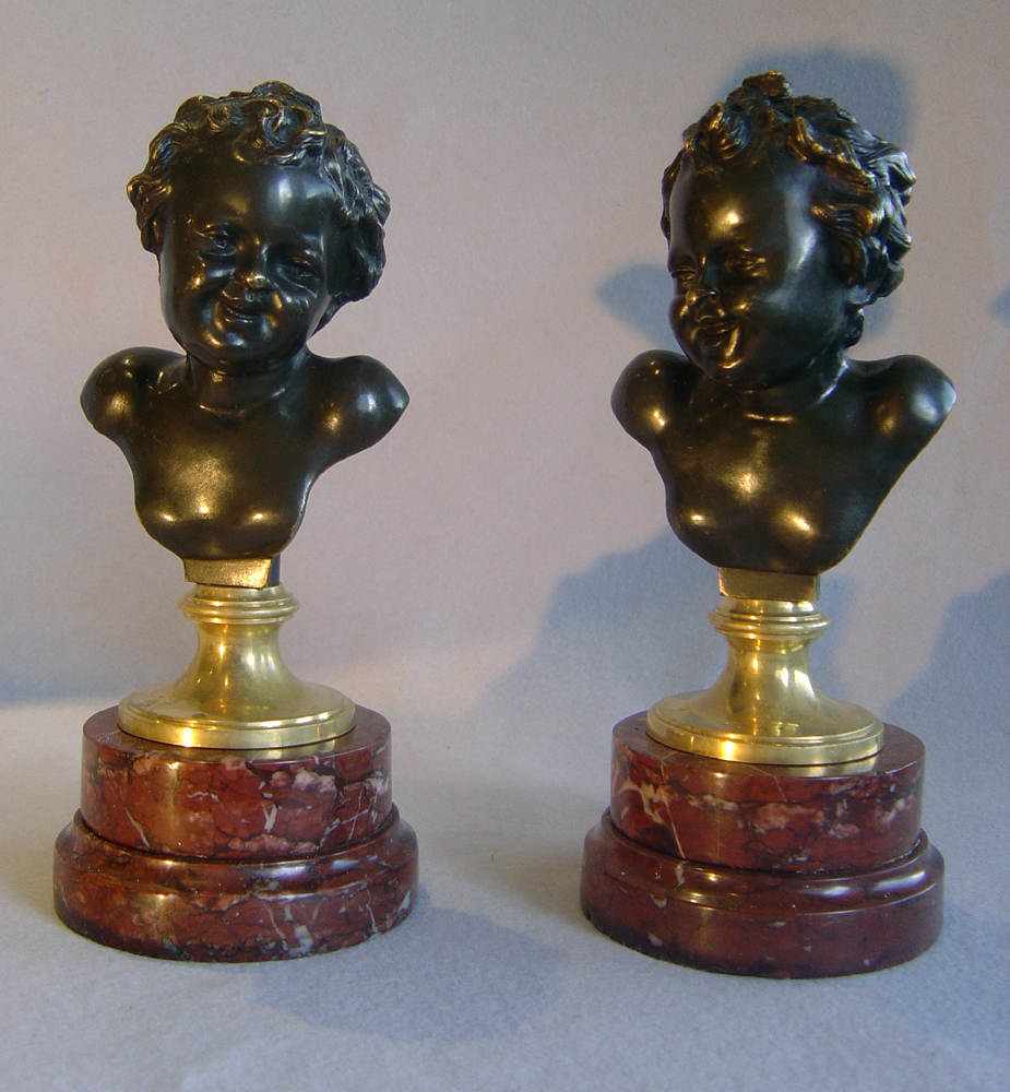 Antique French pair of heads of laughing children after
