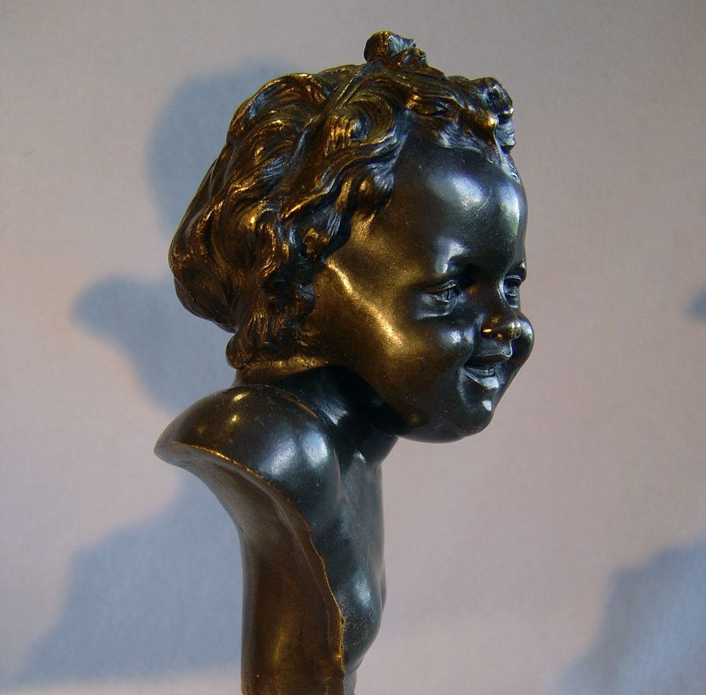 Antique French pair of heads of laughing children after