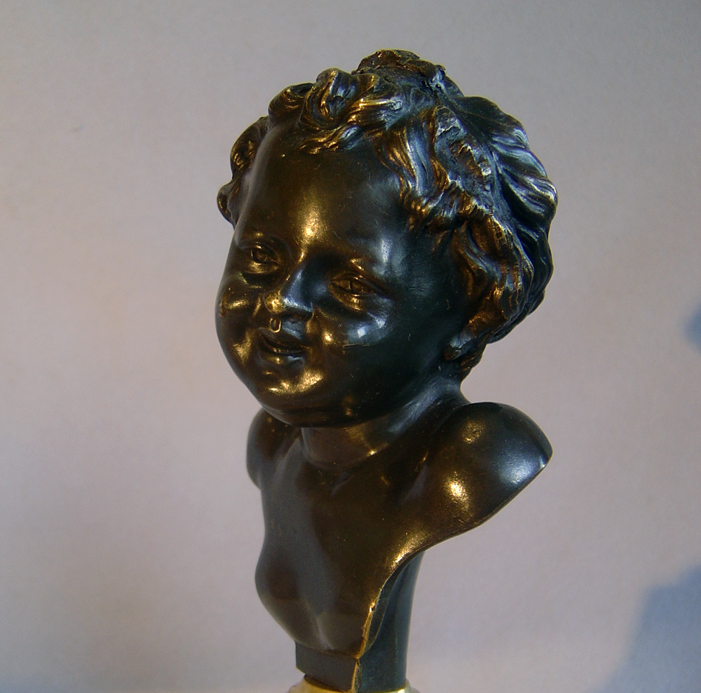 Antique French pair of heads of laughing children after