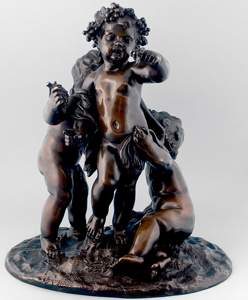 Antique French bronze of three putti.