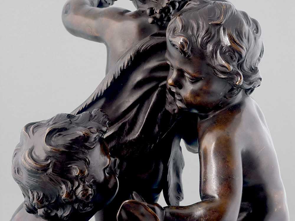 Antique French bronze of three putti.