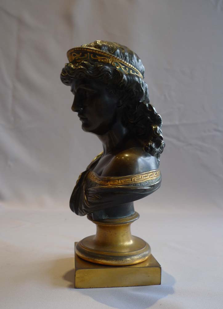 Antique bust of a classical woman in patinated bronze and ormolu.