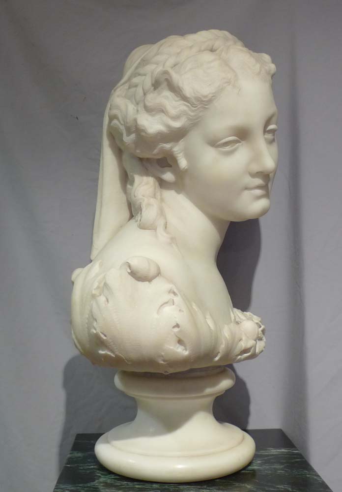 Antique Italian carrera marble bust of Flora on circular socle.
