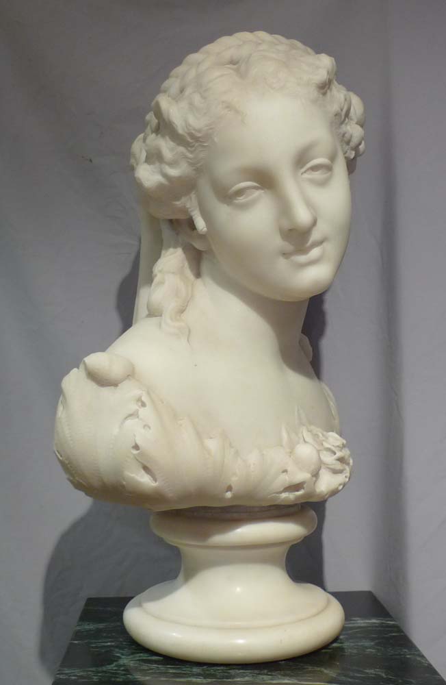 Antique Italian carrera marble bust of Flora on circular socle.