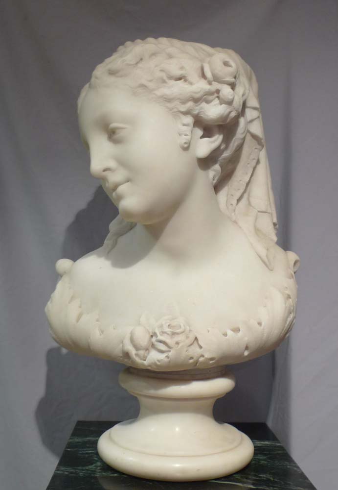 Antique Italian carrera marble bust of Flora on circular socle.