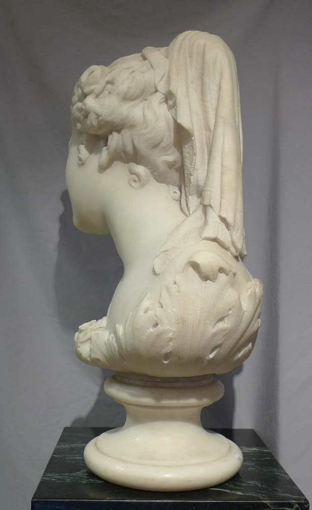 Antique Italian carrera marble bust of Flora on circular socle.