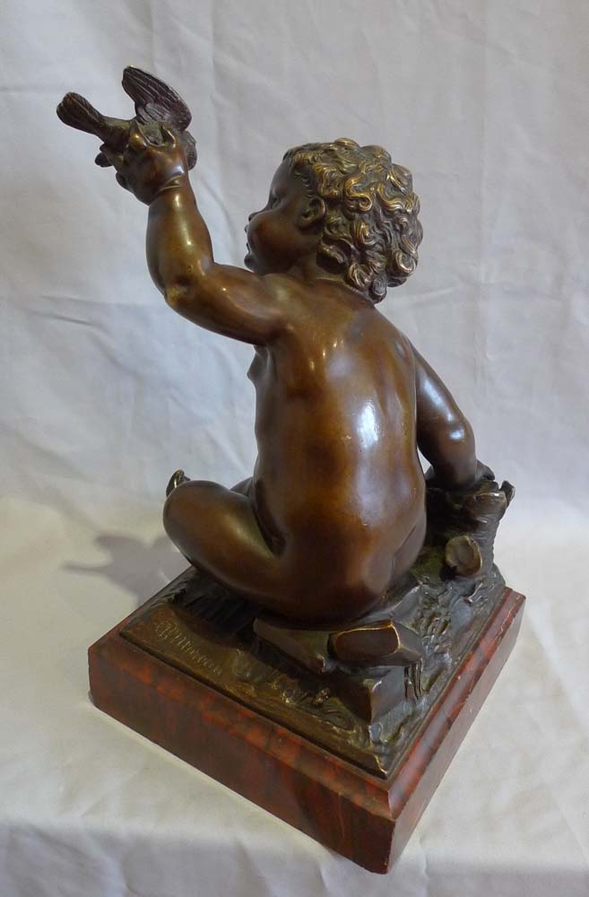 Antique French bronze of putti signed A Moreau, on rouge marble base