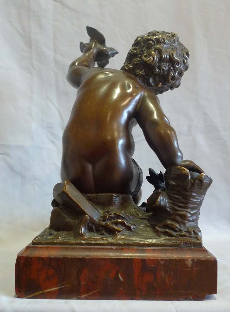 Antique French bronze of putti signed A Moreau, on rouge marble base