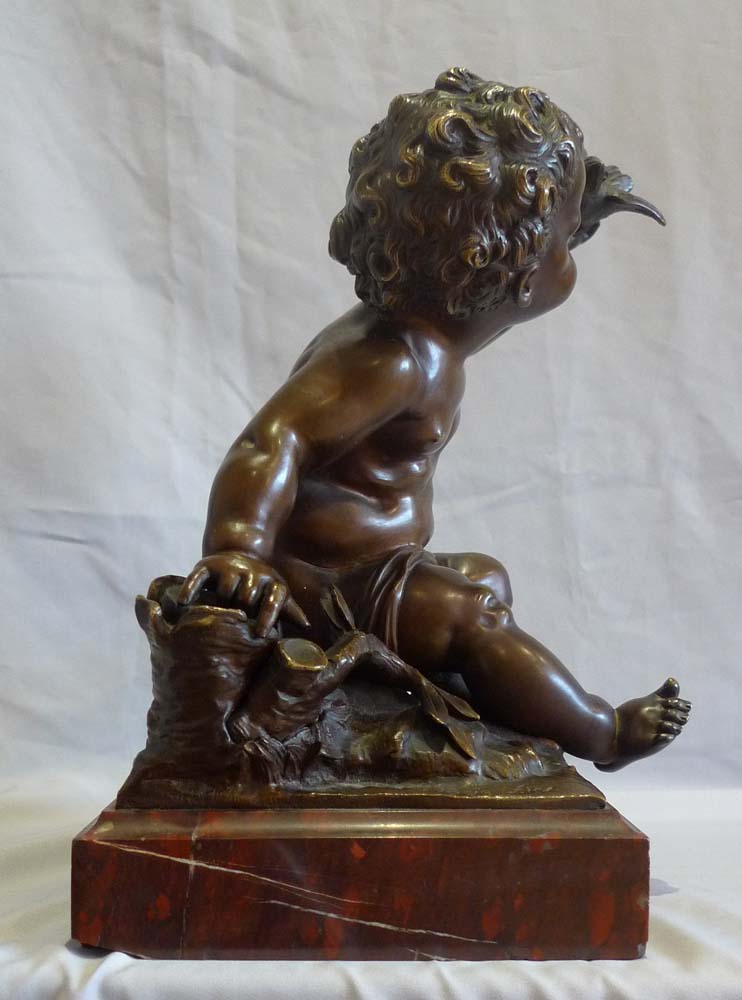 Antique French bronze of putti signed A Moreau, on rouge marble base