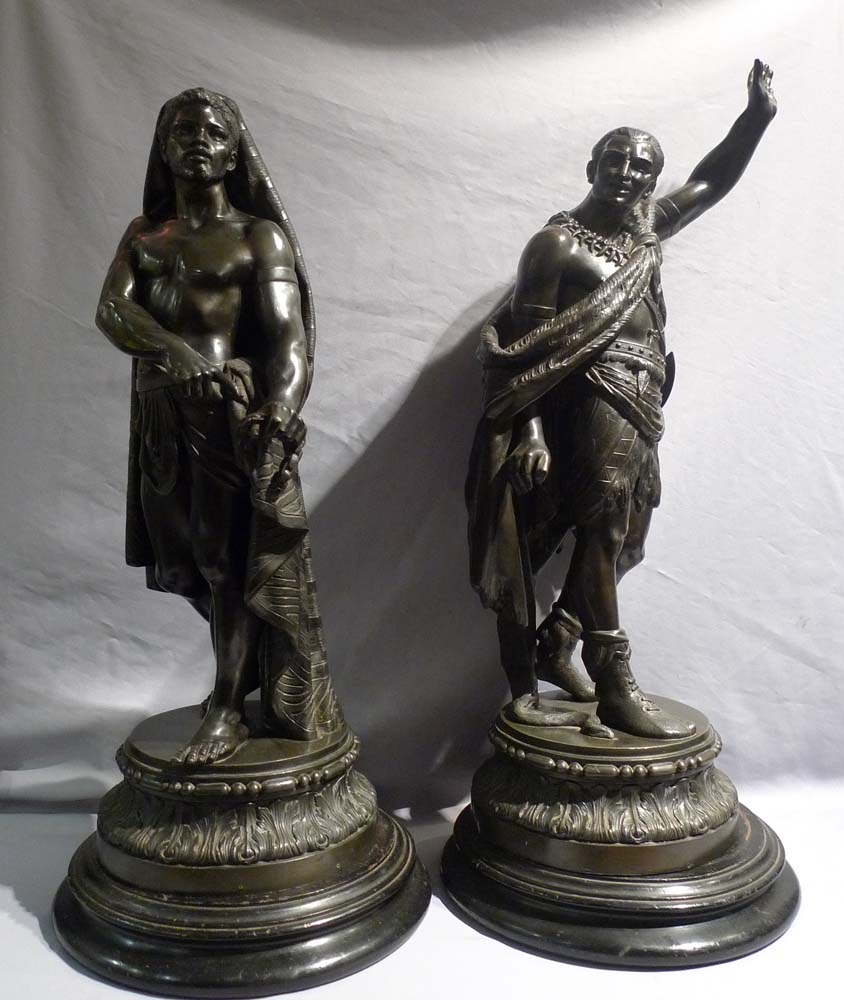 Antique pair of figures depicting America and Africa in bronzed spelter of fine quality.
