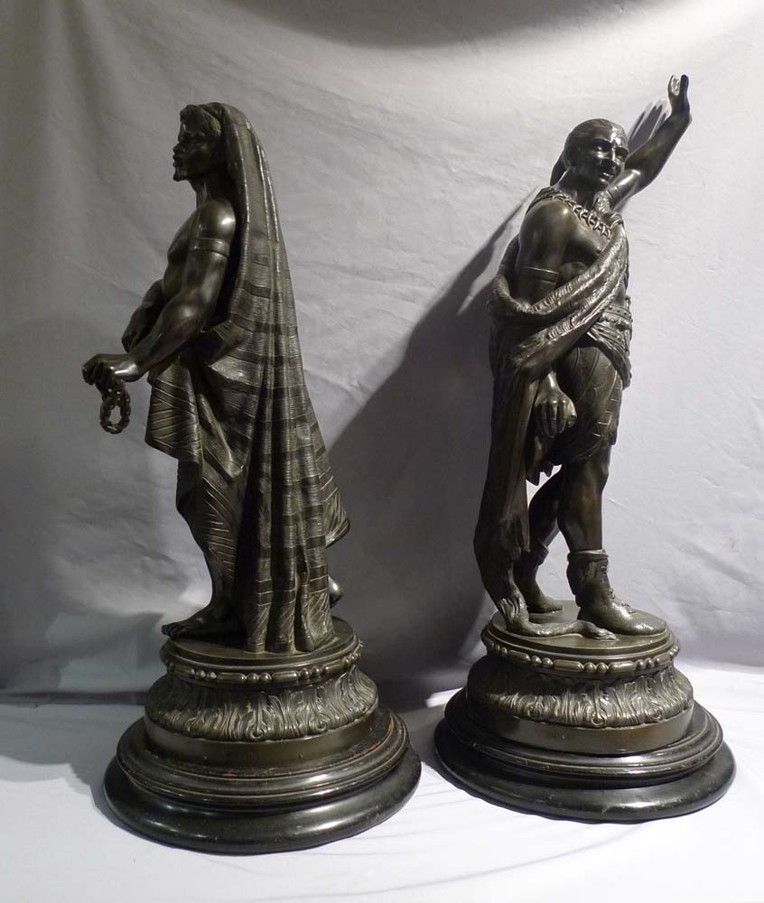 Antique pair of figures depicting America and Africa in bronzed spelter of fine quality.