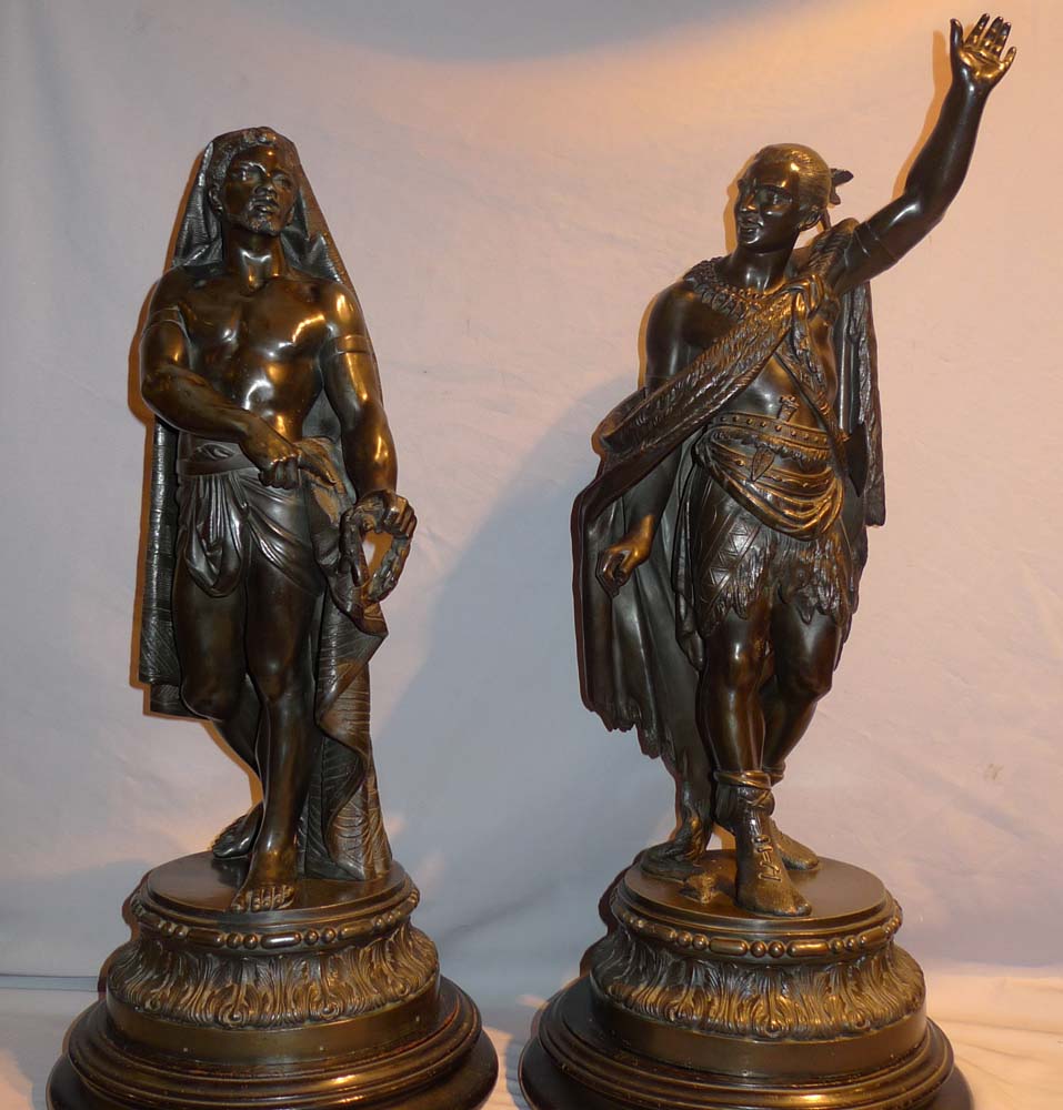 Antique pair of figures depicting America and Africa in bronzed spelter of fine quality.