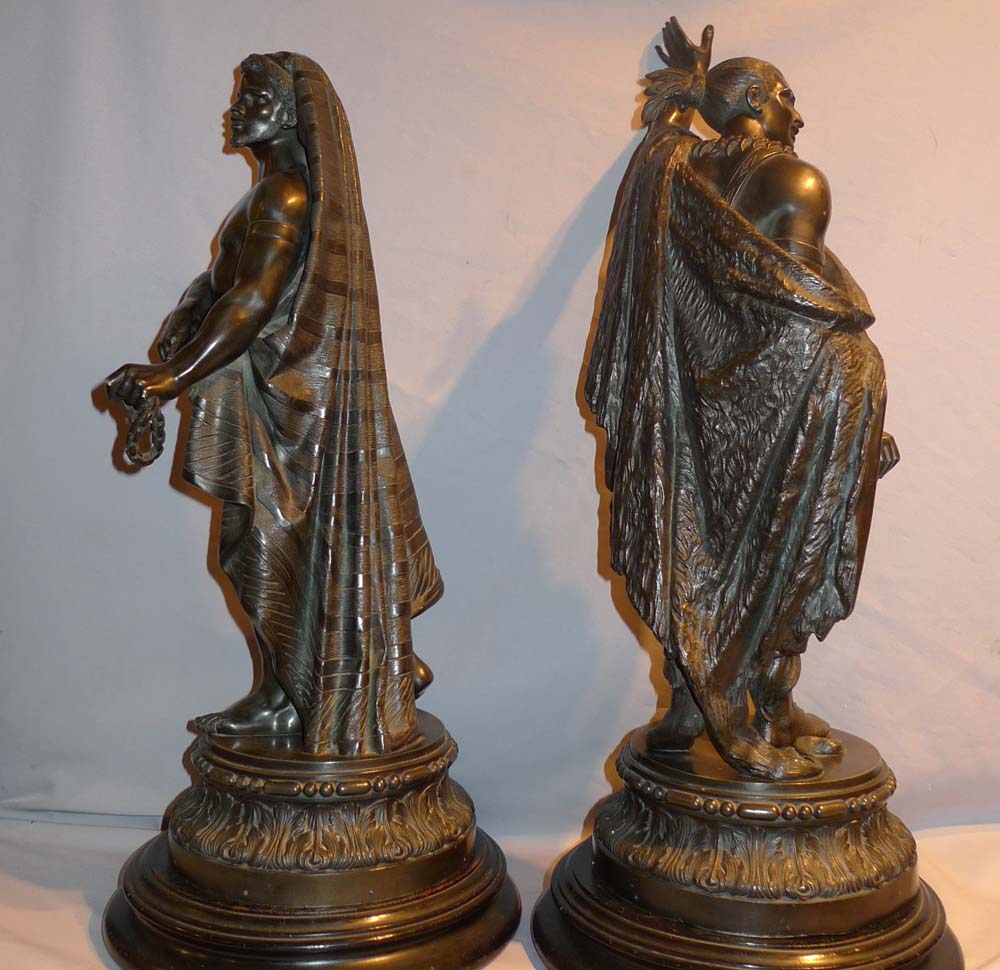 Antique pair of figures depicting America and Africa in bronzed spelter of fine quality.