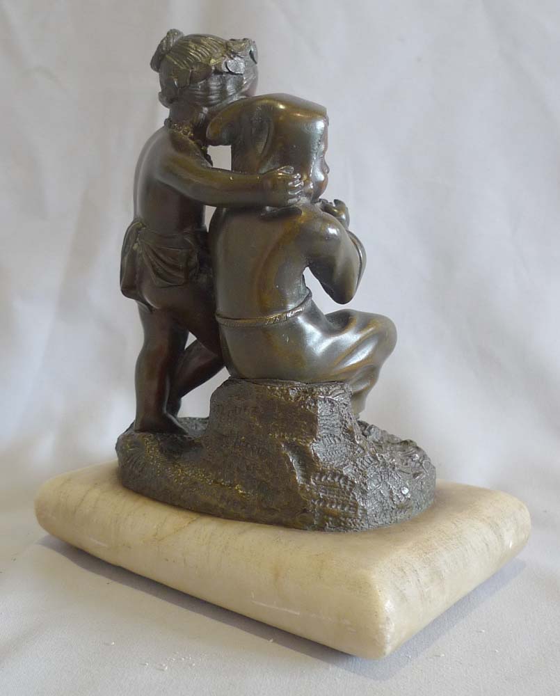 Antique French patinated bronze group of two children on white marble cushion base, mid 19th century